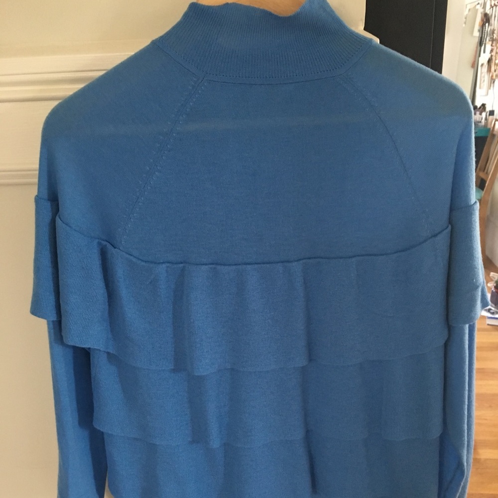 Light blue ruffled sweater